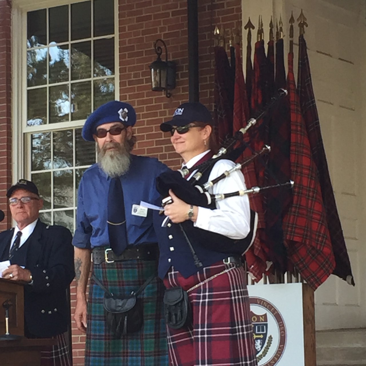 bagpiper being awarded a scholarship